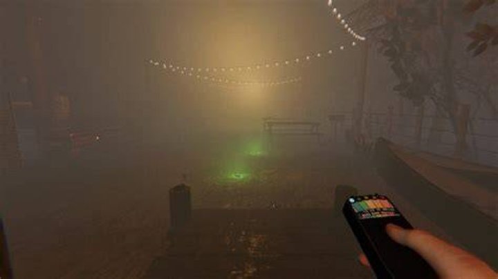 A player holding an EMF Reader faces the Tortured Voodoo Doll in a bedroom of a house in Phasmophobia.