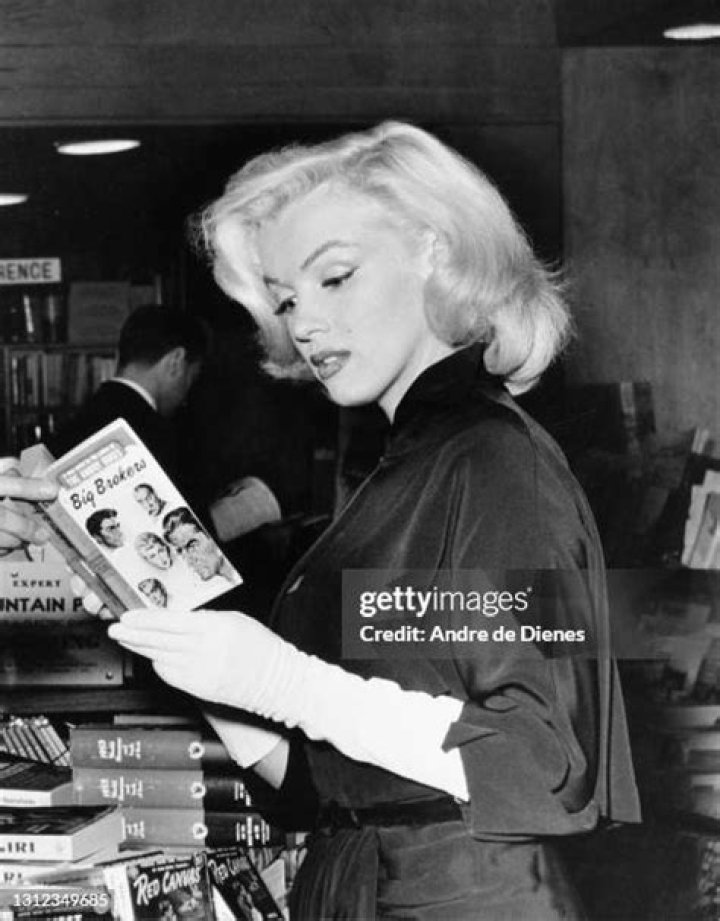 Actor Marilyn Monroe reads a script at Hollywood agent Johnny Hyde's house in Beverly Hills