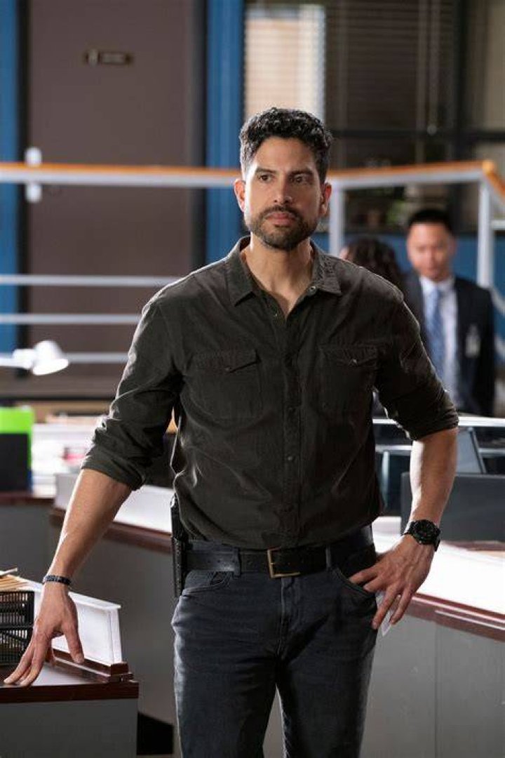 Adam Rodriguez as Luke Alvez and A.J. Cook as JJ wearing bulletproof vests at night in Criminal Minds: Evolution Episode 5
