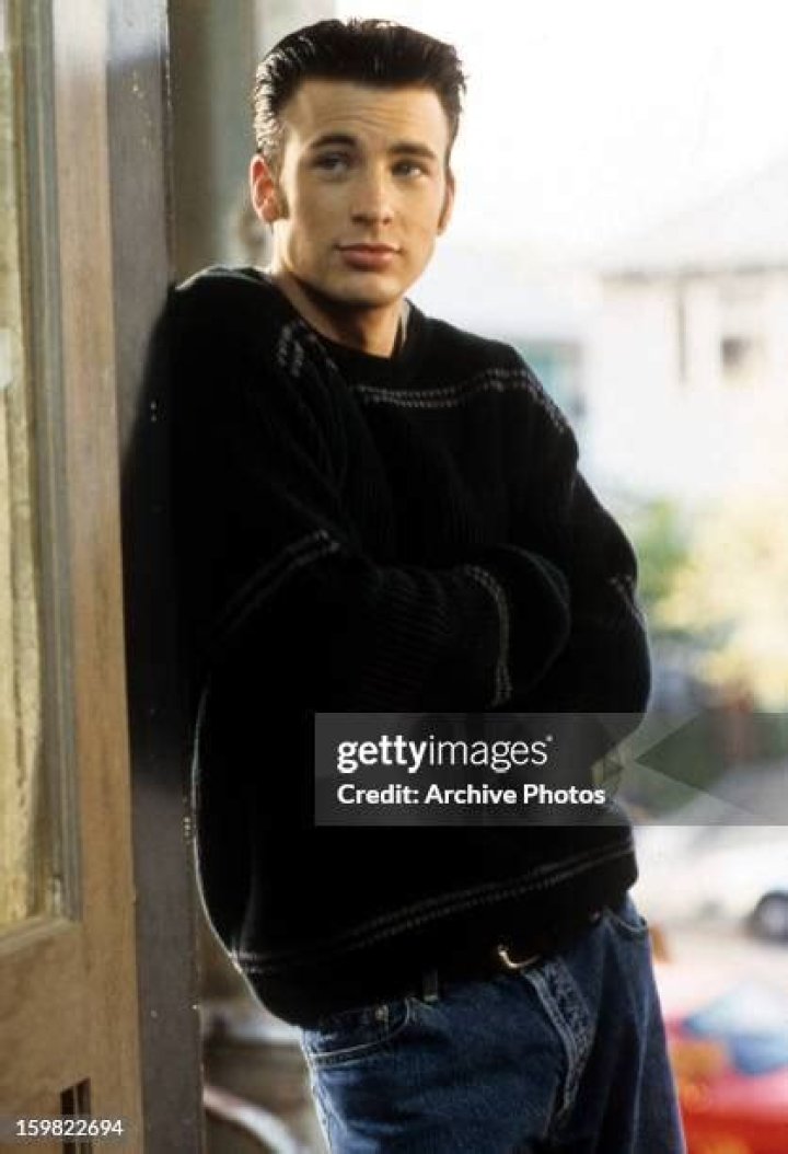 Chris Evans leans against a door in a scene from the film 'Not Another Teen Movie,' 2001.