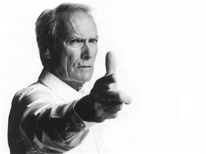 Clint Eastwood posing in a suit at the the 20th Annual AFI Awards at Four Seasons Hotel Los Angele.