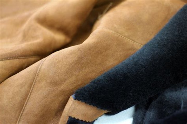 Clothing, Footwear, Human, Textile, Outerwear, Style, Fur clothing, Fashion accessory, Dress, Street fashion, 