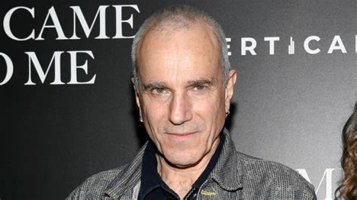 Daniel Day-Lewis posing at the "Arthur Miller - One Night 100 Years" benefit wearing a grey hat.