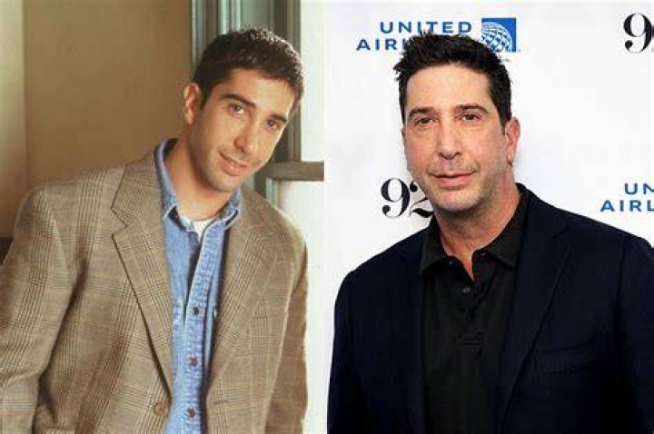 David Schwimmer as Ross and Jennifer Aniston as Rachel stand together on a balcony at night, deep in conversation.