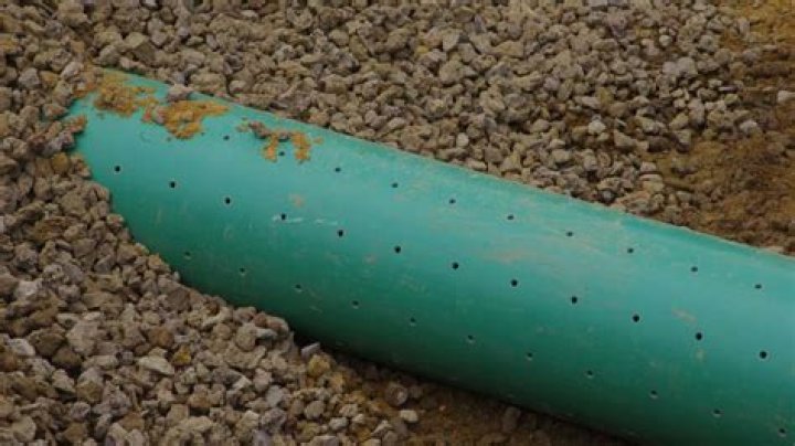 Do drain pipe holes go up or down?