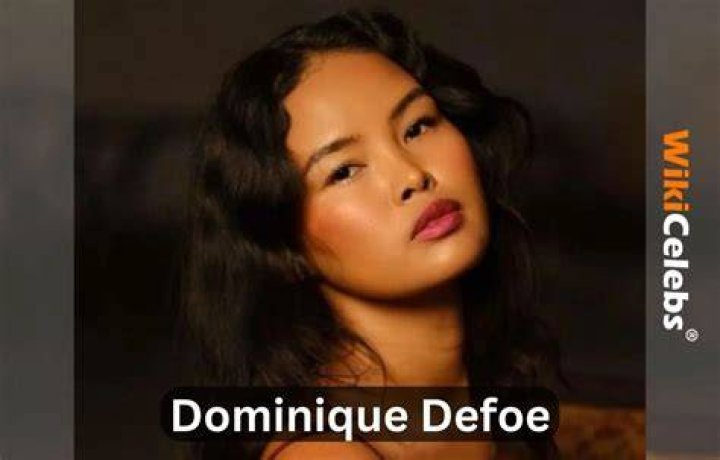 Dominique Defoe of 'Too Hot to Handle' poses in a green bikini on the beach.