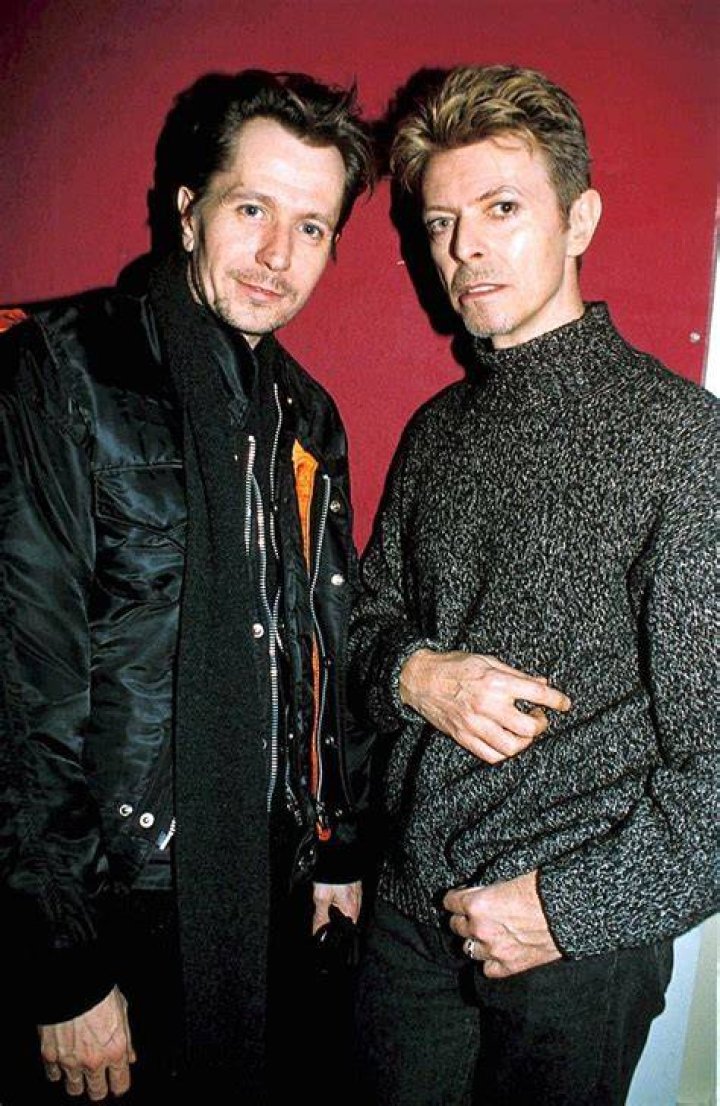 Gary Oldman, David Bowie, and Edward Norton posing for the camera in 2004.