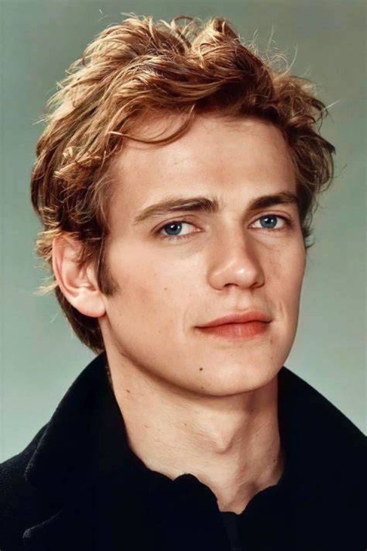 Hayden Christensen poses in front of the Millennium Falcon in Disneyland's Star Wars: Galaxy's Edge attraction. Christensen net worth hits eight figures in part because of 'Star Wars.'