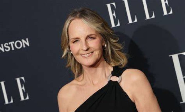 Helen Hunt smiling in front of a blue background