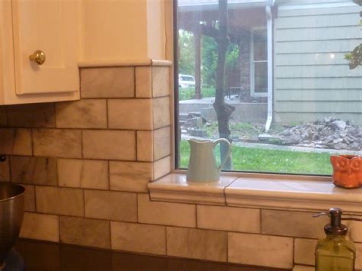 How do you install tile trim around a window?