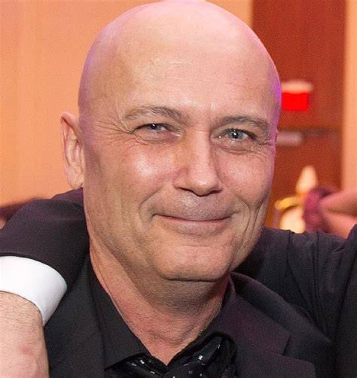 Michael Kopsa sitting at a desk in the Hallmark movie 'Chronicle Mysteries: The Wrong Man'