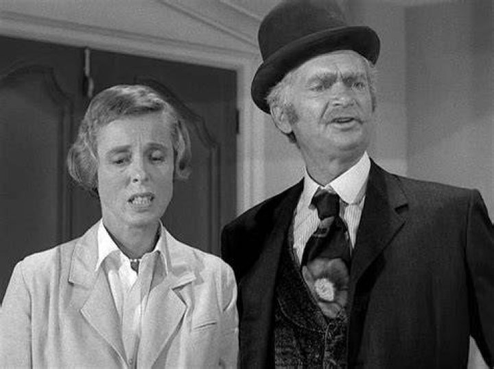 Nancy Kulp and Buddy Ebsen as Jane Hathaway and Jed Clampett stand together in an episode of 'The Beverly Hillbillies.' Their bitter fued bled over into politics years after the series ended.