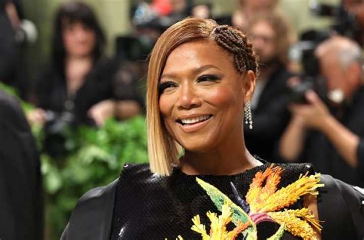 Queen Latifah smiles before heading to an Oscars event.