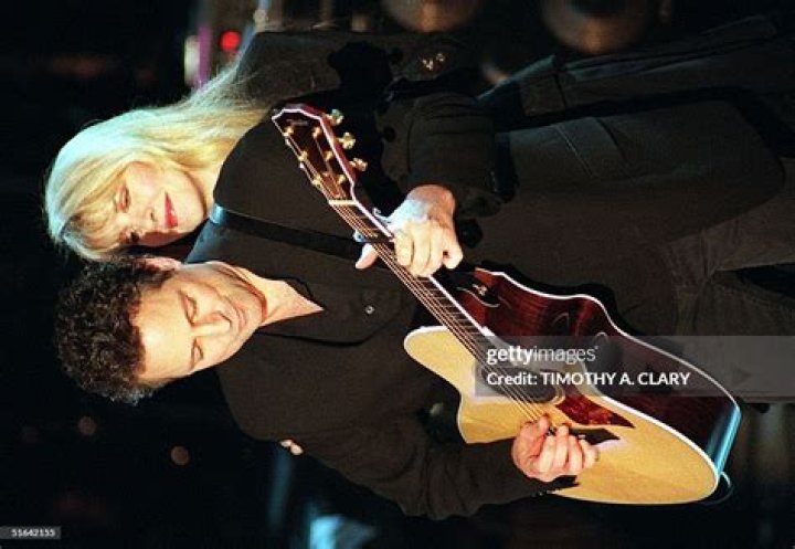 Stevie Nicks peers over the top of her sunglasses.
