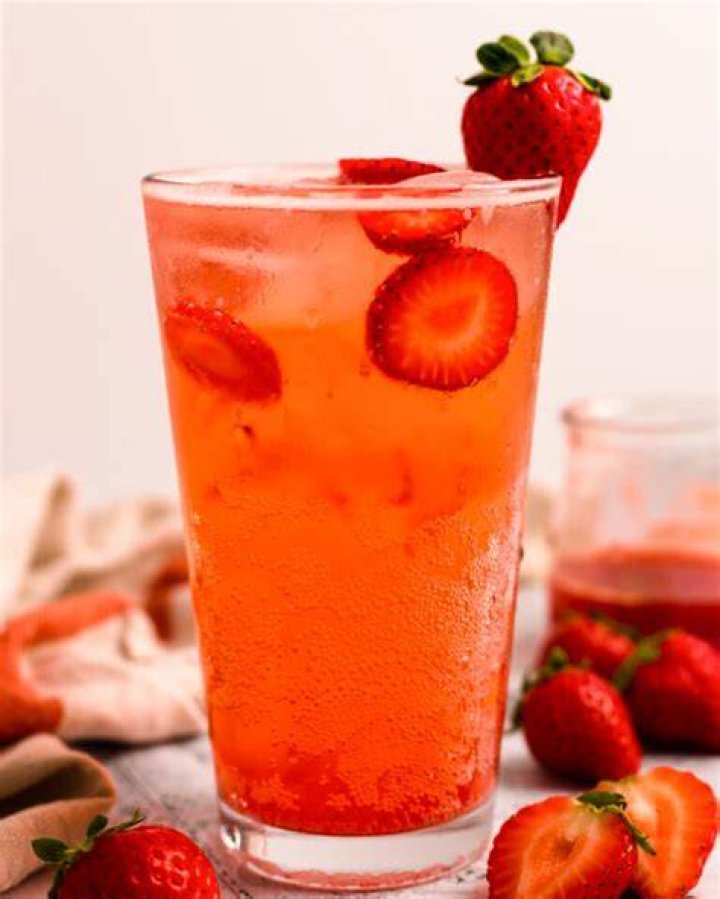 strawberry submerged in soda