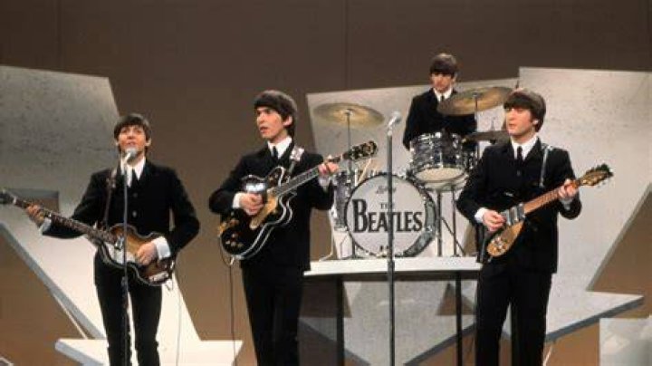 The Beatles' Paul McCartney, Ringo Starr, John Lennon, and George Harrison in a row