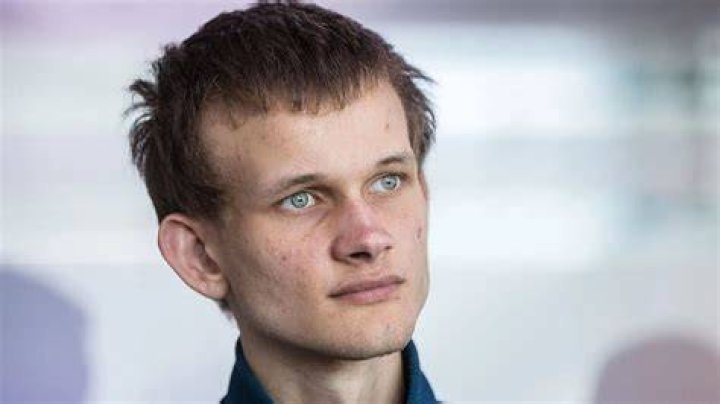 Vitalik Buterin sat in front of a Shiba Inu Coin (SHIB) logo